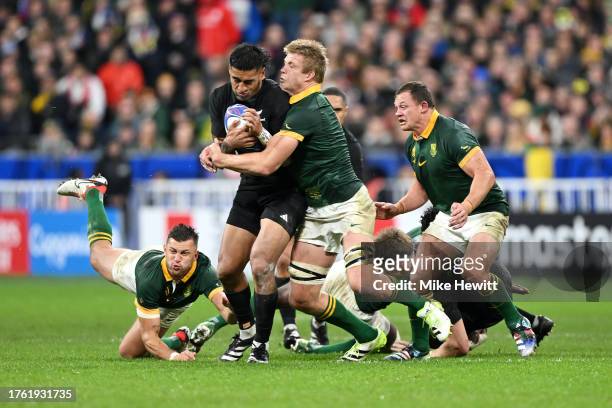 Rieko Ioane of New Zealand is tackled by Pieter-Steph Du Toit of South Africa during the Rugby World Cup Final match between New Zealand and South...