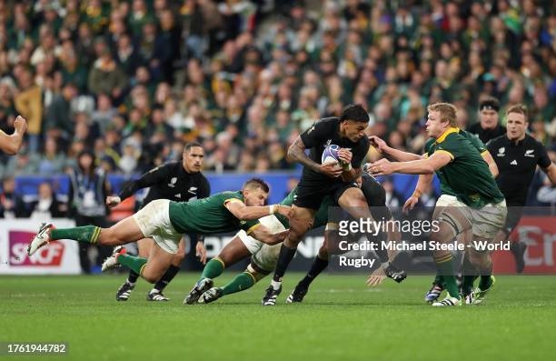 Rieko Ioane of New Zealand runs with the ball whilst under pressure from Pieter-Steph Du Toit of South Africa during the Rugby World Cup Final match...