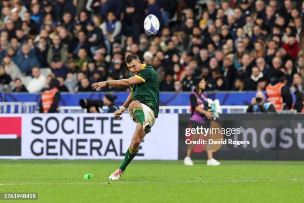 Handre Pollard of South Africa kicks the team's fourth penalty during the Rugby World Cup Final match between New Zealand and South Africa at Stade...