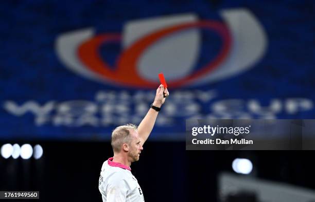 Referee Wayne Barnes upgrades Sam Cane of New Zealand's yellow card to a red card during the Rugby World Cup Final match between New Zealand and...