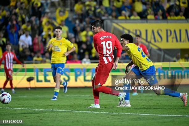 Atletico Madrid's Spanish forward Alvaro Morata scores a goal during the Spanish league football match between UD Las Palmas and Club Atletico de...