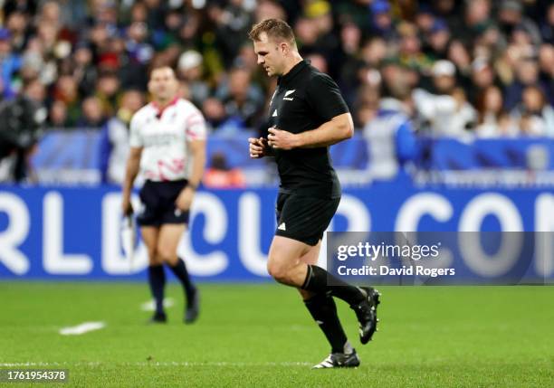 Sam Cane of New Zealand leaves the pitch after receiving a yellow card that is later upgraded to a red card during the Rugby World Cup Final match...