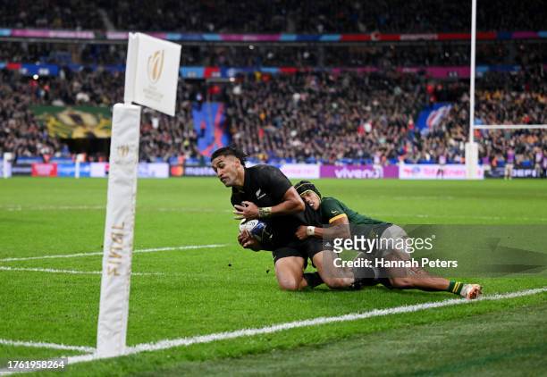 Rieko Ioane of New Zealand is tackled by Kurt-Lee Arendse of South Africa during the Rugby World Cup Final match between New Zealand and South Africa...