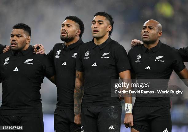 Samisoni Taukei'aho, Richie Mo'unga, Rieko Ioane and Mark Telea of New Zealand line up during the National Anthems prior to the Rugby World Cup Final...