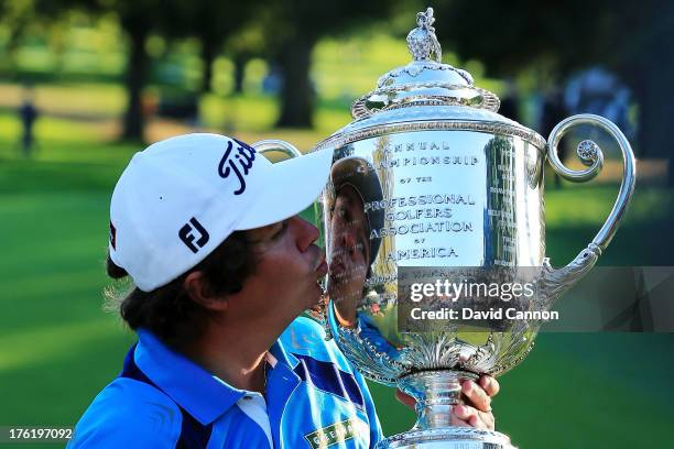 Jason Dufner of the United States kisses the Wanamaker Trophy after his two-stroke victory at the 95th PGA Championship at Oak Hill Country Club on...