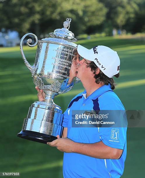 Jason Dufner of the United States kisses the Wanamaker Trophy after his two-stroke victory at the 95th PGA Championship at Oak Hill Country Club on...