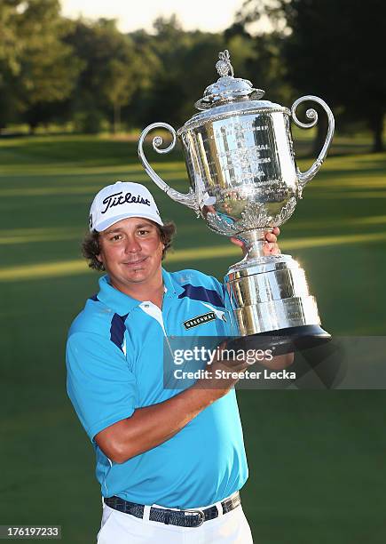 Jason Dufner of the United States poses with the Wanamaker Trophy after his two-stroke victory at the 95th PGA Championship at Oak Hill Country Club...