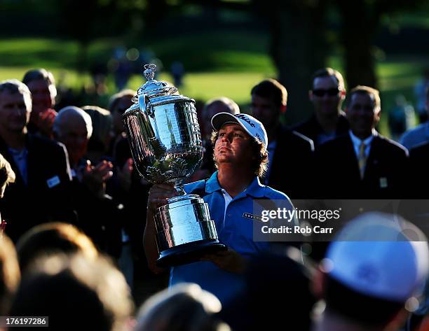 Jason Dufner of the United States poses with the Wanamaker Trophy after his two-stroke victory at the 95th PGA Championship at Oak Hill Country Club...