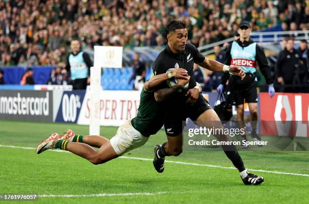 Rieko Ioane of New Zealand is tackled by zaf1 during the Rugby World Cup Final match between New Zealand and South Africa at Stade de France on...