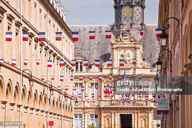 french flags flying in the city of reims. - bastille day stock pictures, royalty-free photos & images