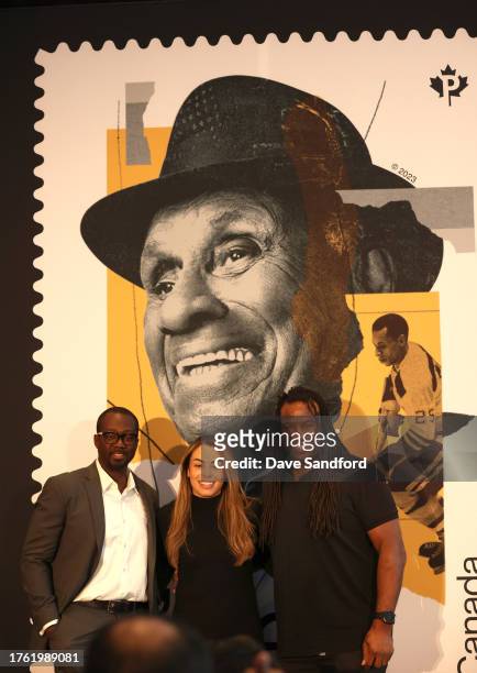Women's Canadian National team player Sarah Nurse and former NHL players Anson Carter and Georges Laraque pose for a photo onstage at the Canada Post...