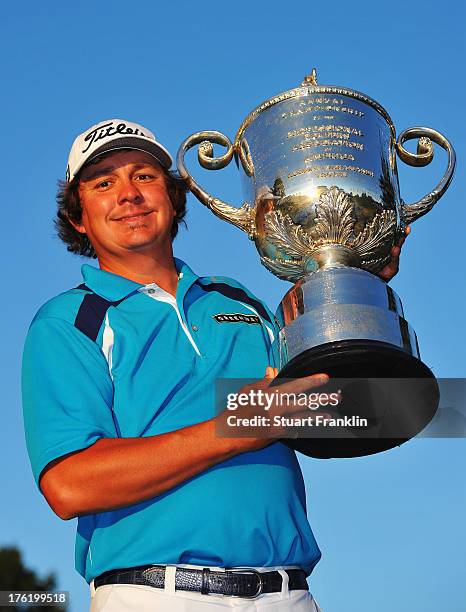 Jason Dufner of the United States poses with the Wanamaker Trophy after his two-stroke victory at the 95th PGA Championship at Oak Hill Country Club...