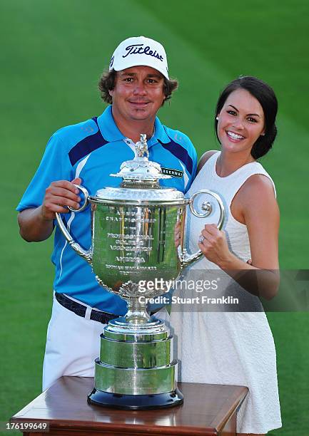 Jason Dufner of the United States and his wife Amanda pose with the Wanamaker tophy after his two-stroke victory at the 95th PGA Championship at Oak...