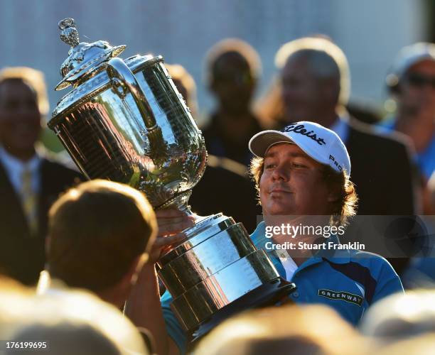 Jason Dufner of the United States poses with the Wanamaker Trophy after his two-stroke victory at the 95th PGA Championship at Oak Hill Country Club...