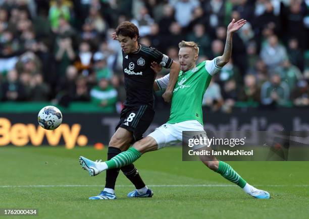 Paulo Bernardo of Celtic vies with Jimmy Jeggo of Hibernian during the Cinch Scottish Premiership match between Hibernian FC and Celtic FC at Easter...