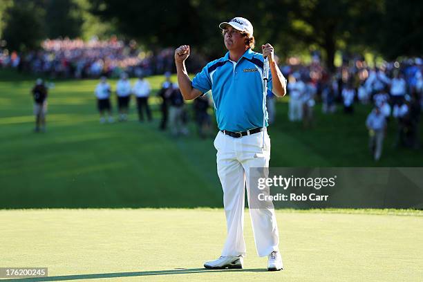 Jason Dufner of the United States celebrates on the 18th green after his two-stroke victory at the 95th PGA Championship at Oak Hill Country Club on...