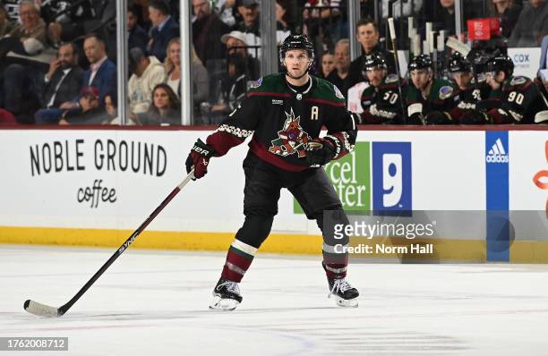 Alex Kerfoot of the Arizona Coyotes skates up ice against the Los Angeles Kings at Mullett Arena on October 27, 2023 in Tempe, Arizona.