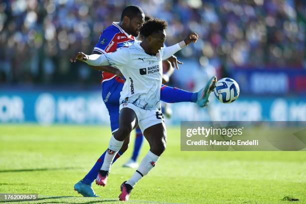 Tinga of Fortaleza and Jhojan Julio of Liga de Quito compete for the ball during the Copa CONMEBOL Sudamericana 2023 final match between LDU Quito...