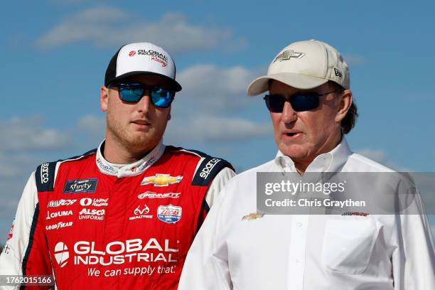 Austin Hill, driver of the Global Industrial Chevrolet, and RCR team owner and NASCAR Hall of Famer, Richard Childress walk the grid prior to the...