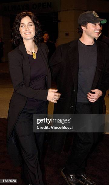 Actress Carrie-Anne Moss and husband Steven Roy attend the screening of the short animated film "Final Flight of the Osiris" and the debut of the...