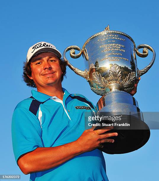 Jason Dufner of the United States poses with the Wanamaker Trophy after his two-stroke victory at the 95th PGA Championship at Oak Hill Country Club...