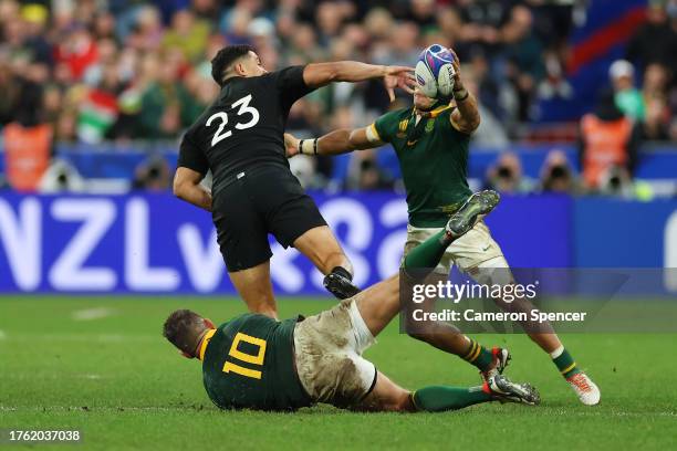 Cheslin Kolbe of South Africa commits a deliberate knock on which leads to Referee Wayne Barnes awarding a penalty to New Zealand during the Rugby...