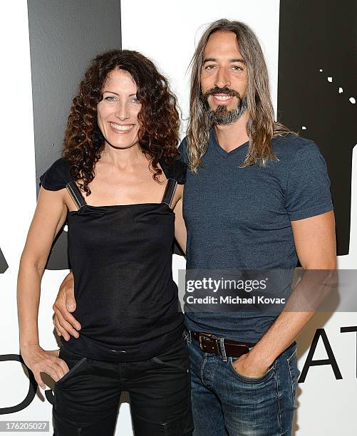 Actress Lisa Edelstein and artist Robert Russell attend the NKLA Pet Adoption Center Opening Celebration at the NKLA Pet Adoption Center on August...