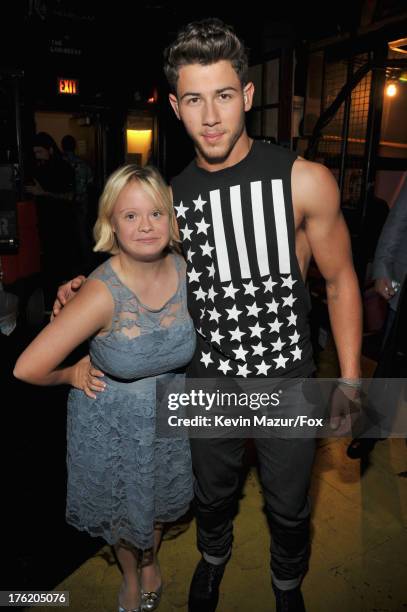 Actress Lauren Potter and musician Nick Jonas attend the 2013 Teen Choice Awards at Gibson Amphitheatre on August 11, 2013 in Universal City,...