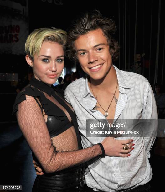 Actress/musician Miley Cyrus and musician Harry Styles of One Direction attend the 2013 Teen Choice Awards at Gibson Amphitheatre on August 11, 2013...