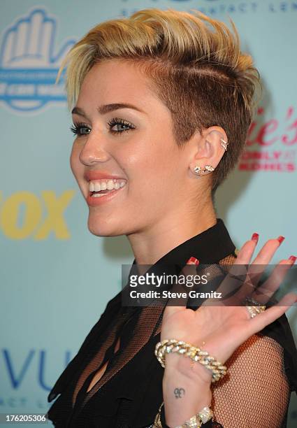 Actress/singer Miley Cyrus poses in the press room at the 2013 Teen Choice Awards at Gibson Amphitheatre on August 11, 2013 in Universal City,...