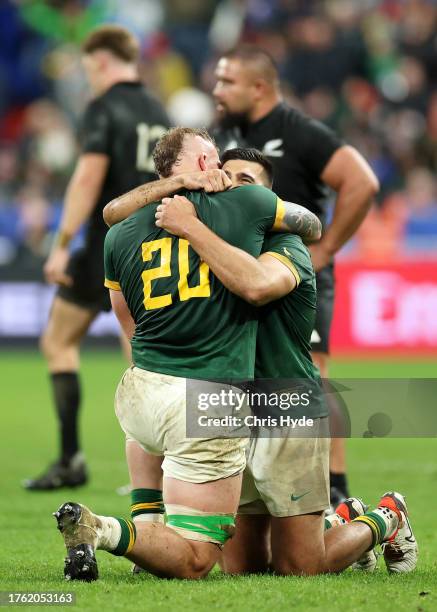 Snyman of South Africa embraces Damian de Allende following the team’s victory during the Rugby World Cup Final match between New Zealand and South...