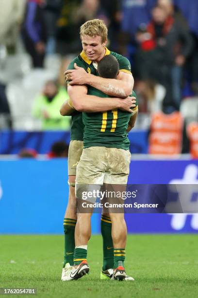 Cheslin Kolbe of South Africa embraces Pieter-Steph Du Toit of South Africa following the team’s victory during the Rugby World Cup Final match...