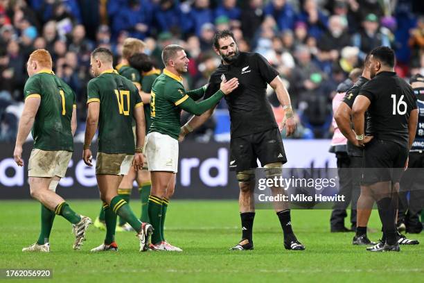 Willie Le Roux of South Africa consoles Samuel Whitelock of New Zealand following the Rugby World Cup Final match between New Zealand and South...