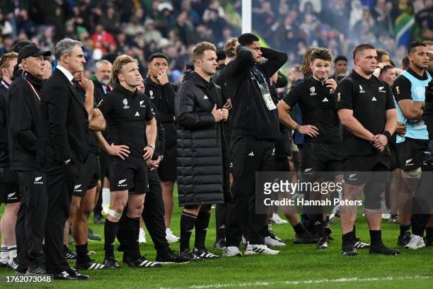 Sam Cane of New Zealand looks dejected as he watches as players of South Africa celebrate after the Rugby World Cup Final match between New Zealand...