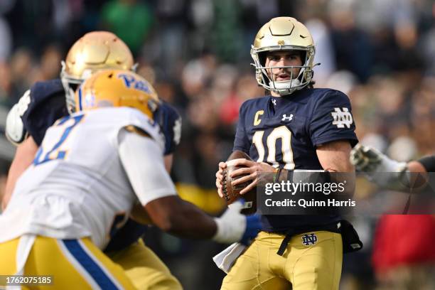 Sam Hartman of the Notre Dame Fighting Irish looks to pass in the first half against the Pittsburgh Panthers at Notre Dame Stadium on October 28,...