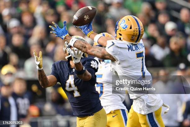 Chris Tyree of the Notre Dame Fighting Irish catches a first down in the first half against Javon McIntyre of the Pittsburgh Panthers at Notre Dame...