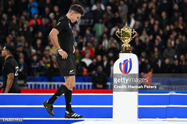 Beauden Barrett of New Zealand looks dejected as he walks past The Webb Ellis Cup after defeat during the Rugby World Cup Final match between New...
