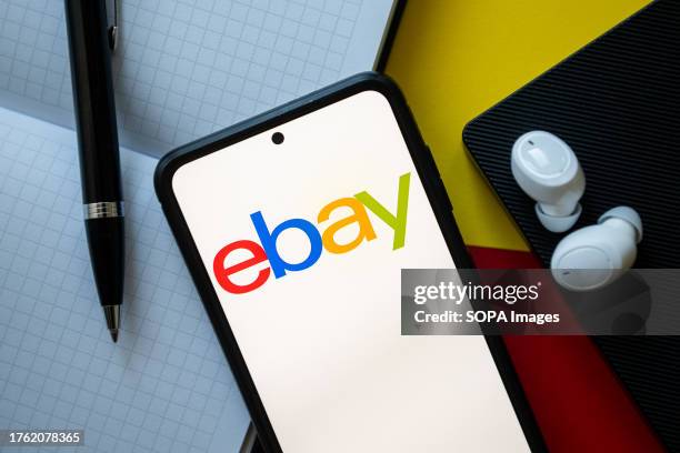 In this photo illustration an Ebay logo seen displayed on a smartphone.