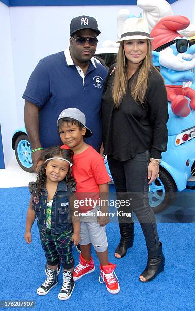 Producer Rodney "Darkchild" Jerkins and wife TV personality/singer Joy Enriquez and their children arrive at the Los Angeles Premiere 'Smurfs 2' on...