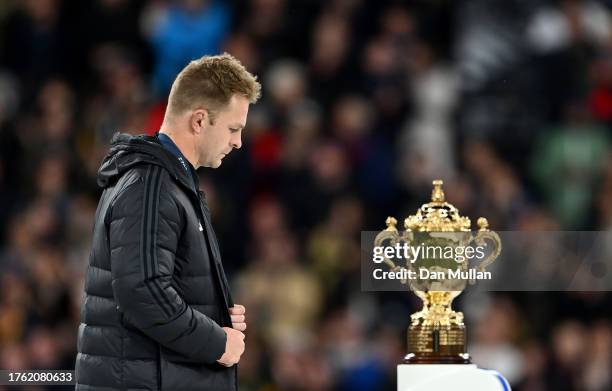 Sam Cane of New Zealand looks dejected as he walks past The Webb Ellis Cup after defeat during the Rugby World Cup Final match between New Zealand...