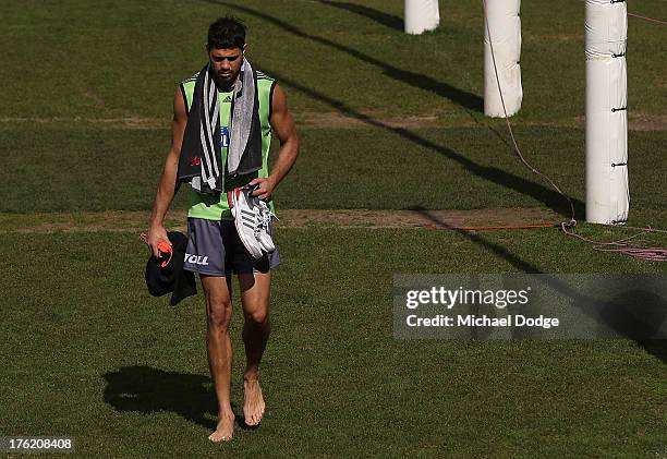 Patrick Ryder walks back from the pool during an Essendon Bombers AFL training session at Windy Hill on August 12, 2013 in Melbourne, Australia.