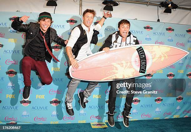 Keaton Stromberg, Drew Chadwick, and Wesley Stromberg of Emblem3 pose in the press room at the 2013 Teen Choice Awards at Gibson Amphitheatre on...