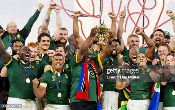 Cyril Ramaphosa, President of South Africa, lifts The Webb Ellis Cup following the Rugby World Cup Final match between New Zealand and South Africa...