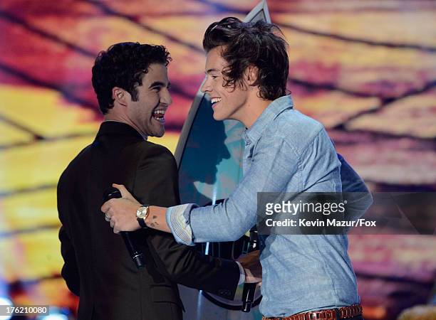 Host Darren Criss and Harry Styles of One Direction speak onstage at the 2013 Teen Choice Awards at Gibson Amphitheatre on August 11, 2013 in...