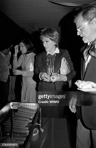 Eve Arden and Brooks West attend a party at the Brunswick Hollywood Legion Lanes in Hollywood, California, on June 7, 1982.