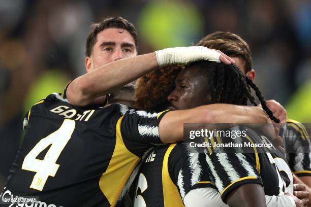 Moise Kean of Juventus is congratulated by team mates Dusan Vlahovic, Federico Gatti, Weston McKennie and Daniele Rugani prior to having a second...