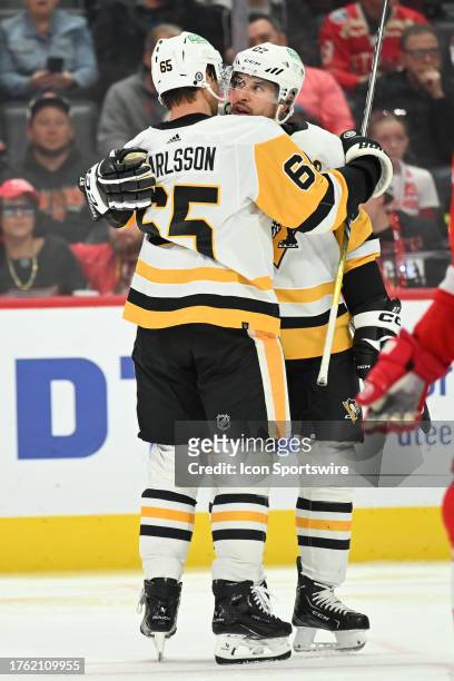 Pittsburgh Penguins Center Sidney Crosby and Pittsburgh Penguins Defenceman Erik Karlsson celebrate Karlsson's 3rd period goal during the game...