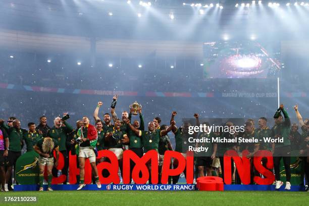 Manie Libbok of South Africa lifts the The Webb Ellis Cup following the Rugby World Cup Final match between New Zealand and South Africa at Stade de...