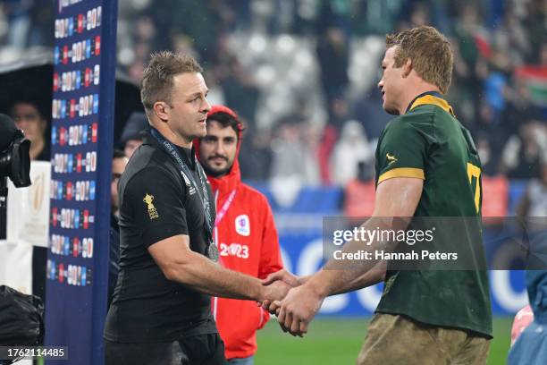 Sam Cane of New Zealand shakes hands with Pieter-Steph Du Toit of South Africa at full-time following the Rugby World Cup Final match between New...
