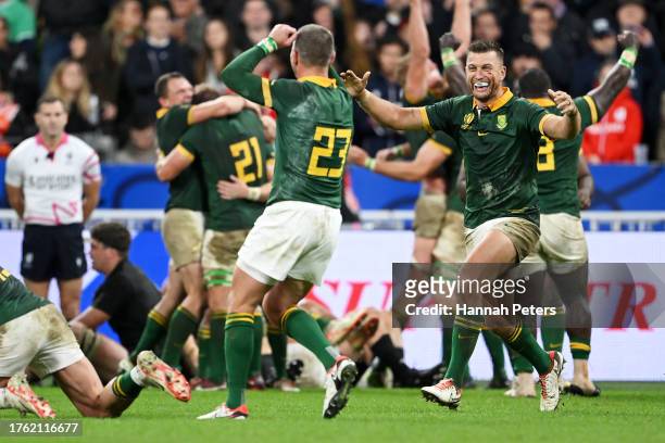 Willie Le Roux and Handre Pollard of South Africa celebrate victory at full-time following the Rugby World Cup Final match between New Zealand and...